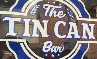 Tin Can Bar Downtown Lansing signage.